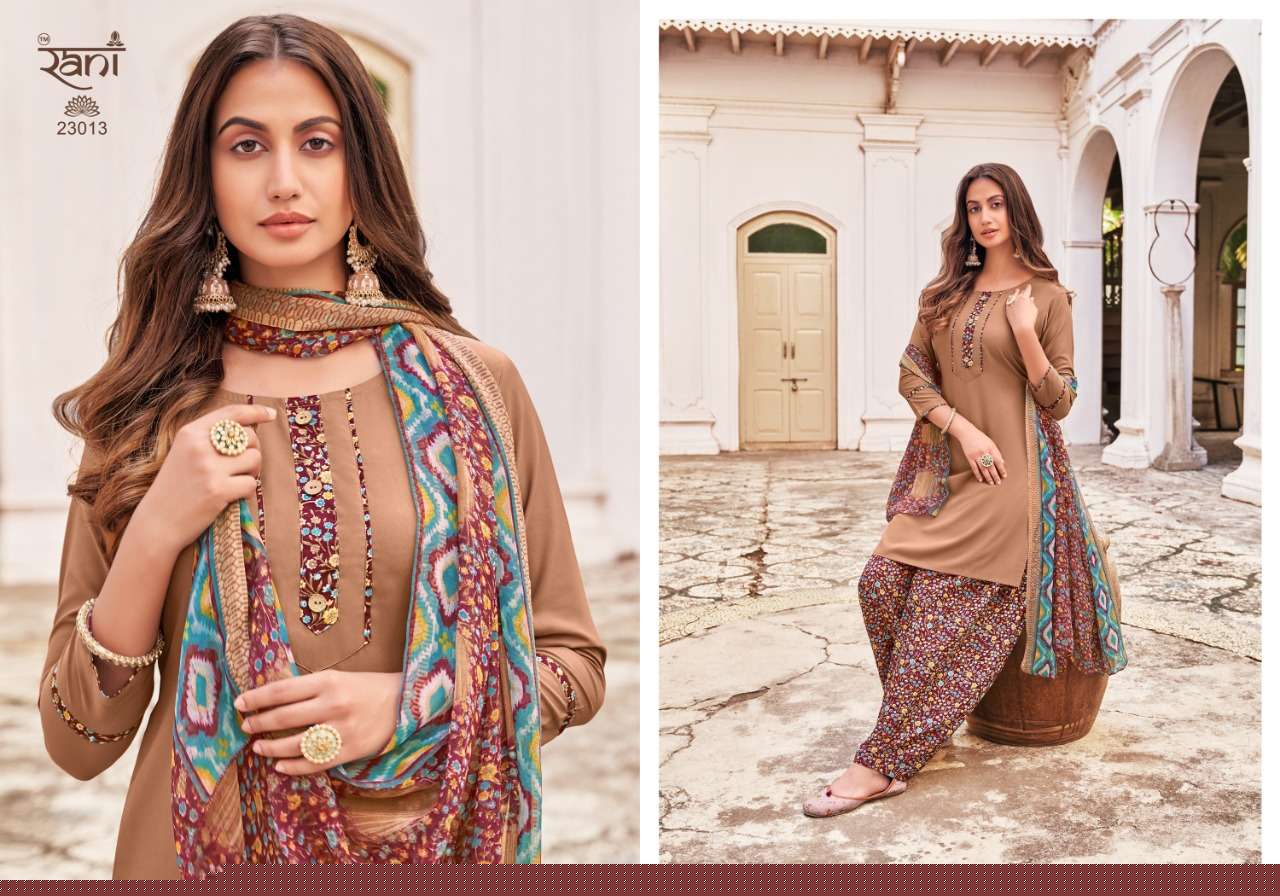SUNHERI VOL-23 BY RANI FASHION 23001 TO 23016 SERIES BEAUTIFUL STYLISH SUITS FANCY COLORFUL CASUAL WEAR & ETHNIC WEAR & READY TO WEAR HEAVY AMERICAN CREPE PRINTED DRESSES AT WHOLESALE PRICE